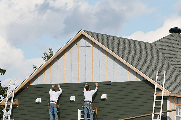 Professional Storm Damage Siding Repair technician working in East Springfield, PA